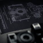 Detailed blueprint of a camera with an official patent from the United States Patent Office.